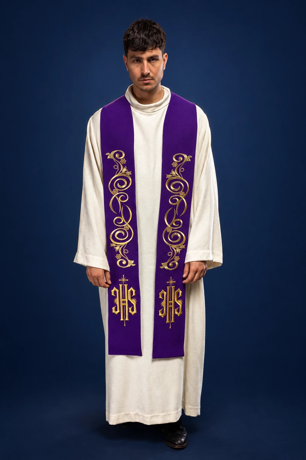 Front view of a purple priest stole with gold scroll embroidery and IHS monograms
