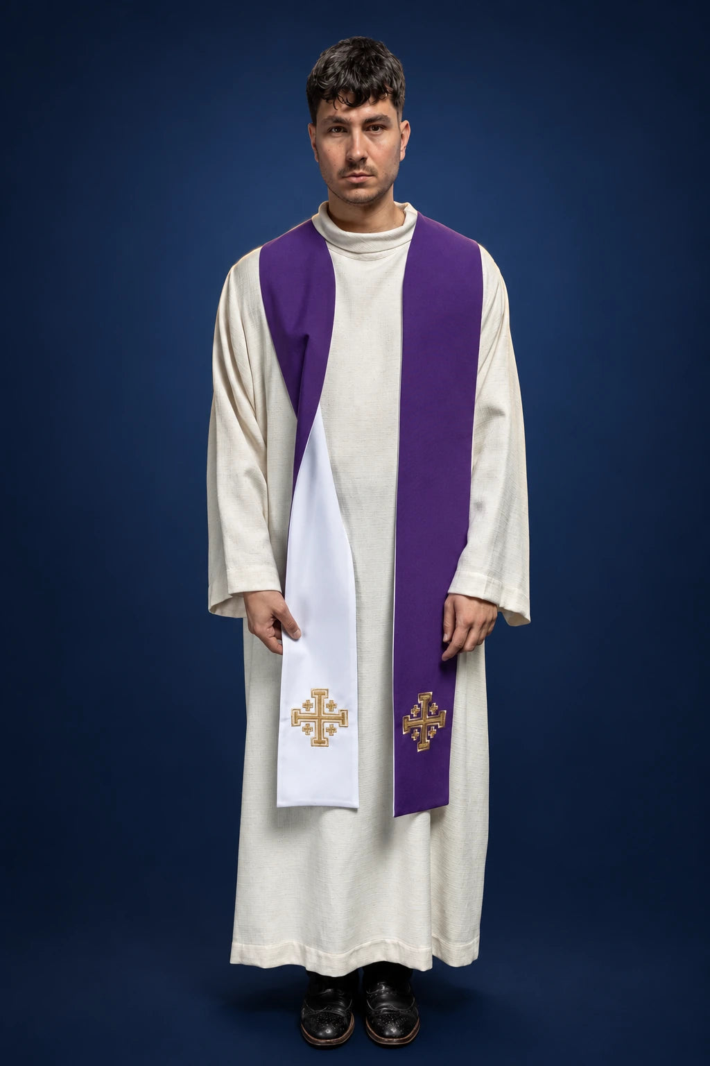 Front view of a purple-and-white double-sided stole with Jerusalem cross embroidery, worn over a white alb