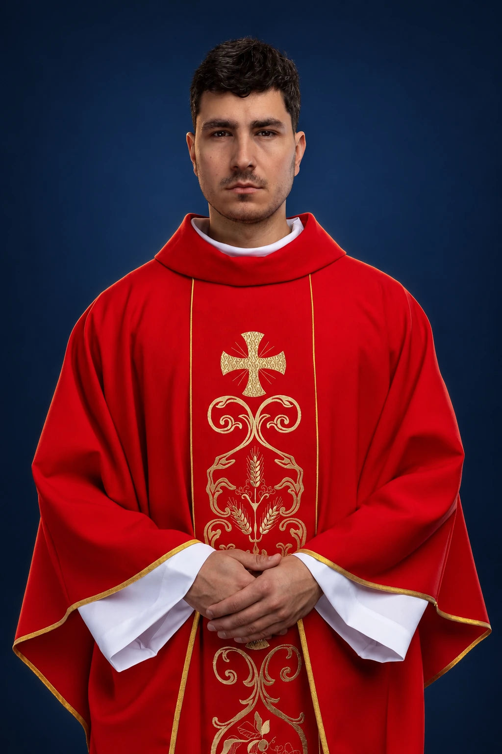 Front view of a red Catholic chasuble with embroidered gold orphrey and cross motif