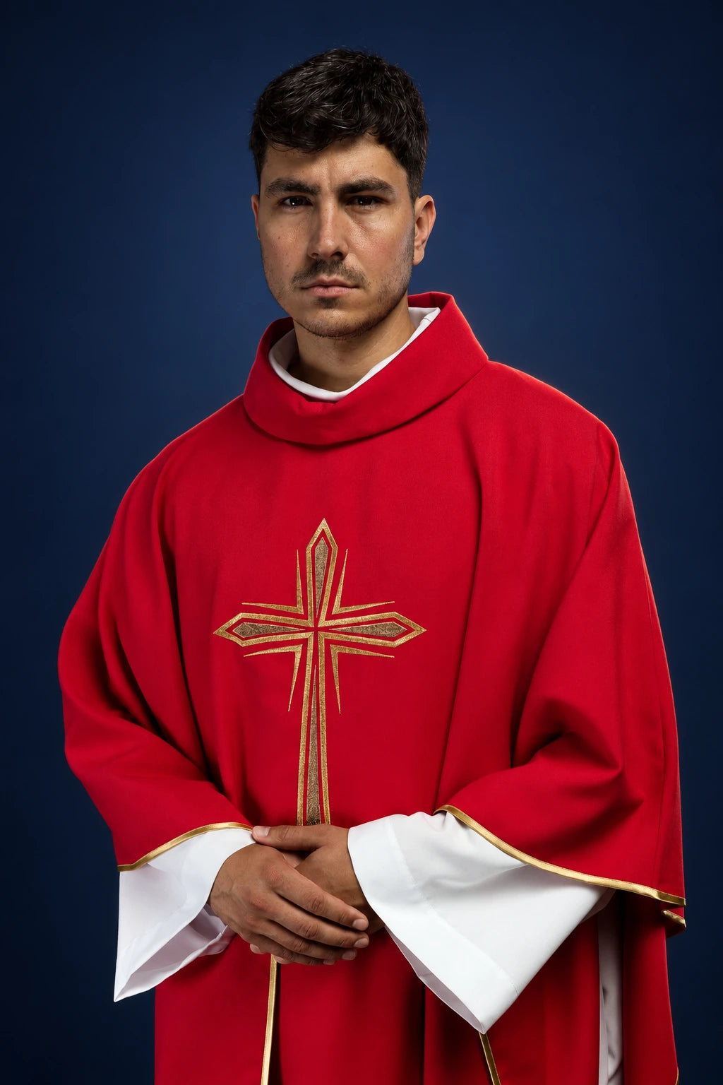 Front view of a red Catholic chasuble with a gold embroidered cross