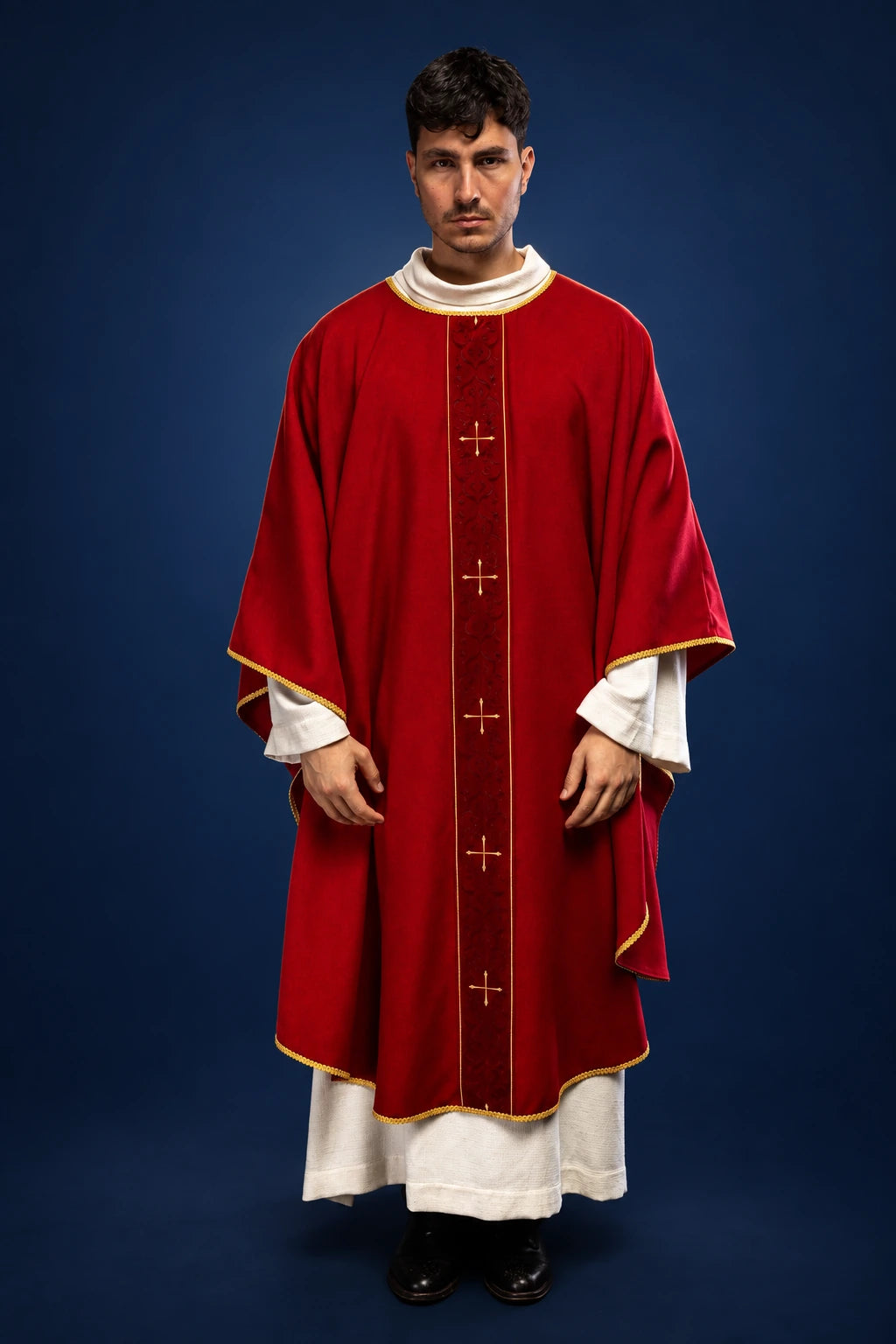 Front view of a red Catholic chasuble with gold-trimmed orphrey and vertical embroidered crosses