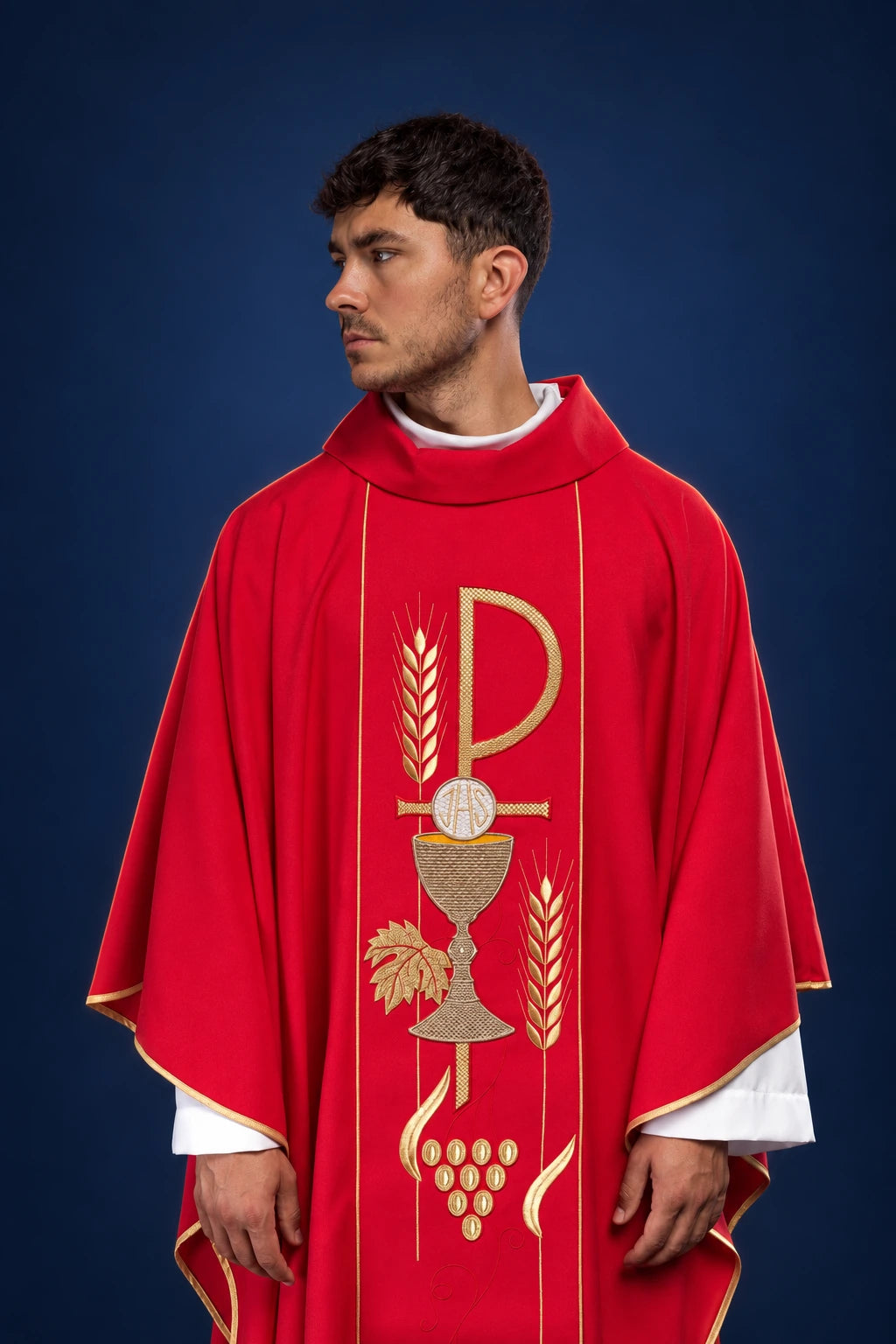 Front view of a red chasuble with gold chalice and IHS embroidery on the chest and vertical wheat motifs