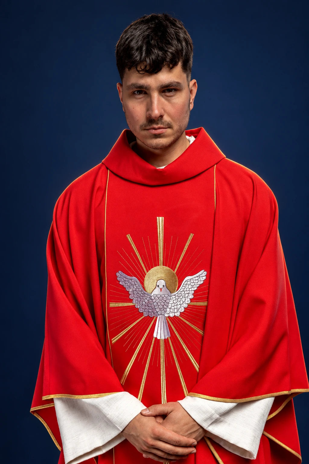 Front view of a red chasuble with gold trim and Holy Spirit dove embroidery on the chest