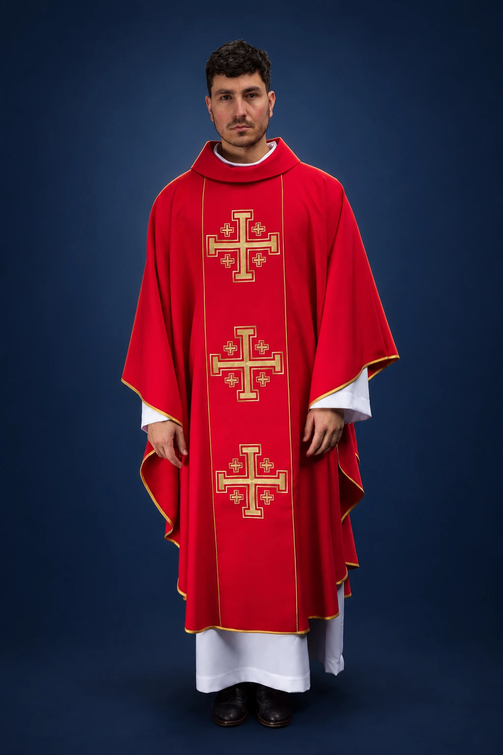 Front view of a red chasuble with gold trim and vertical orphrey featuring three Jerusalem crosses