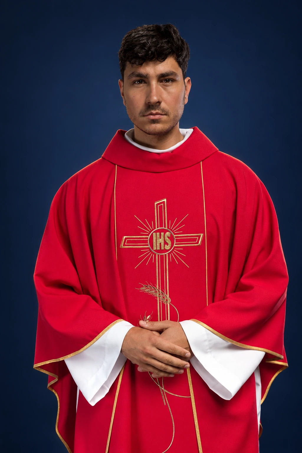 Front view of red chasuble with wide gold embroidered IHS cross orphrey and gold trim