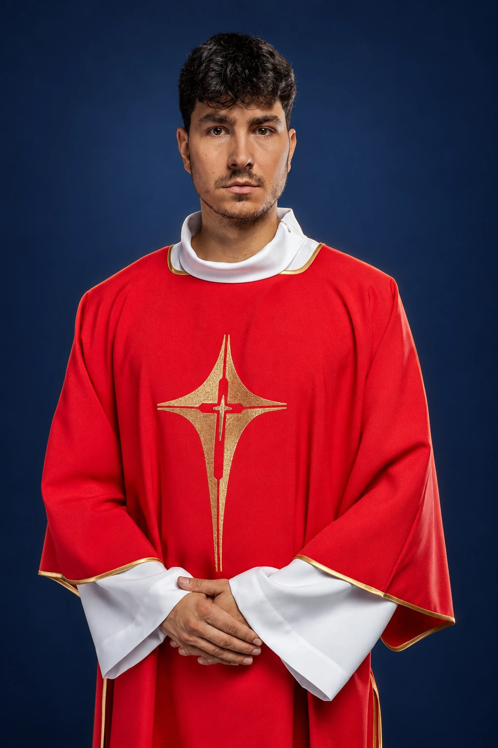 Front view of a red dalmatic with wide sleeves and a gold embroidered cross on the chest
