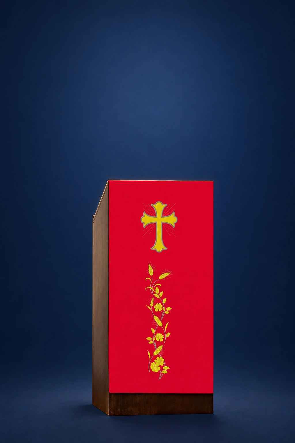 Front view of a red lectern cover embroidered with a gold cross and wheat stalk motif