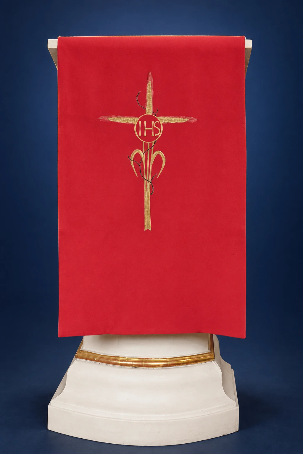 Front view of a red lectern cover with gold cross and IHS embroidery