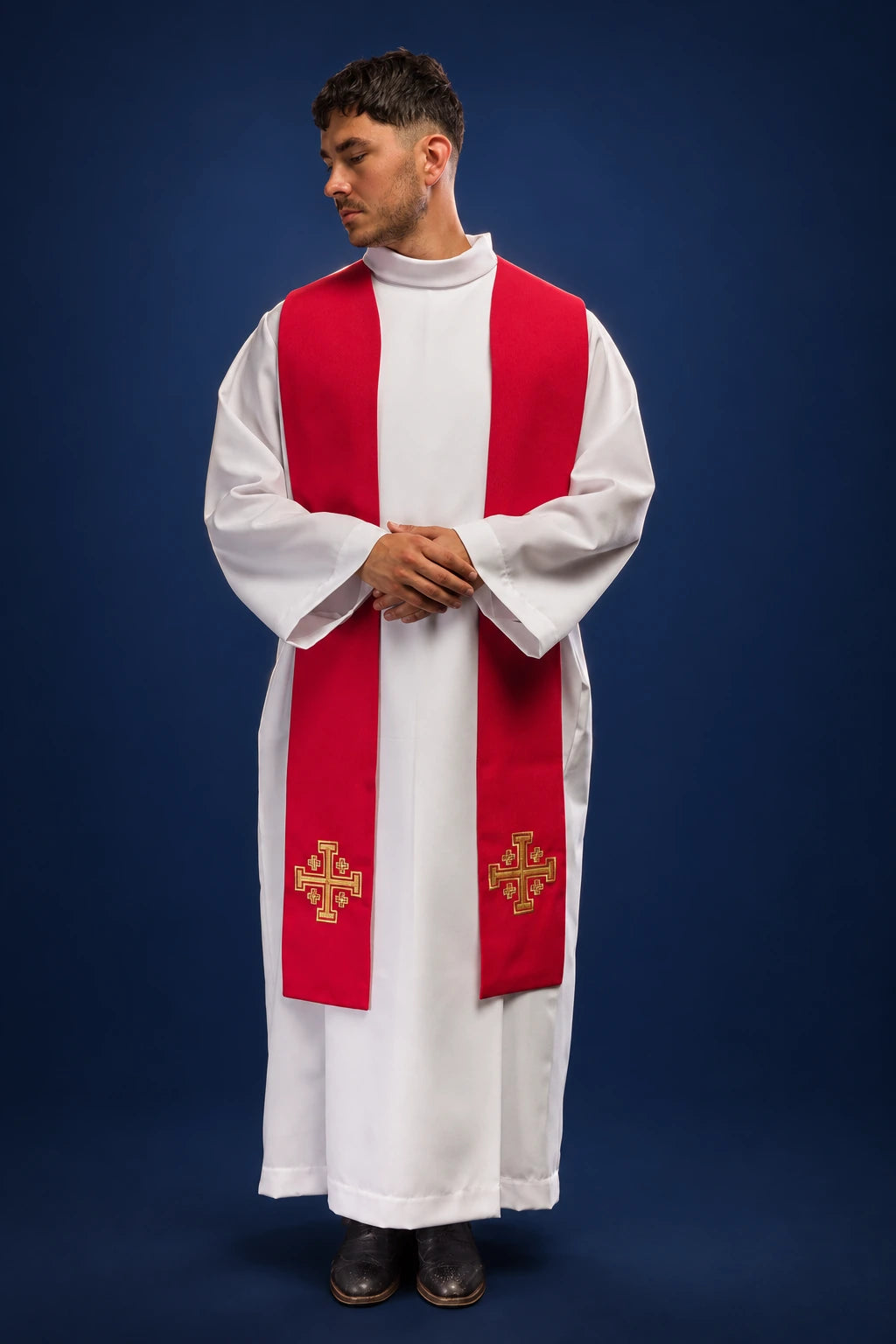 Front view of a red priest stole with embroidered Jerusalem crosses worn over a white alb