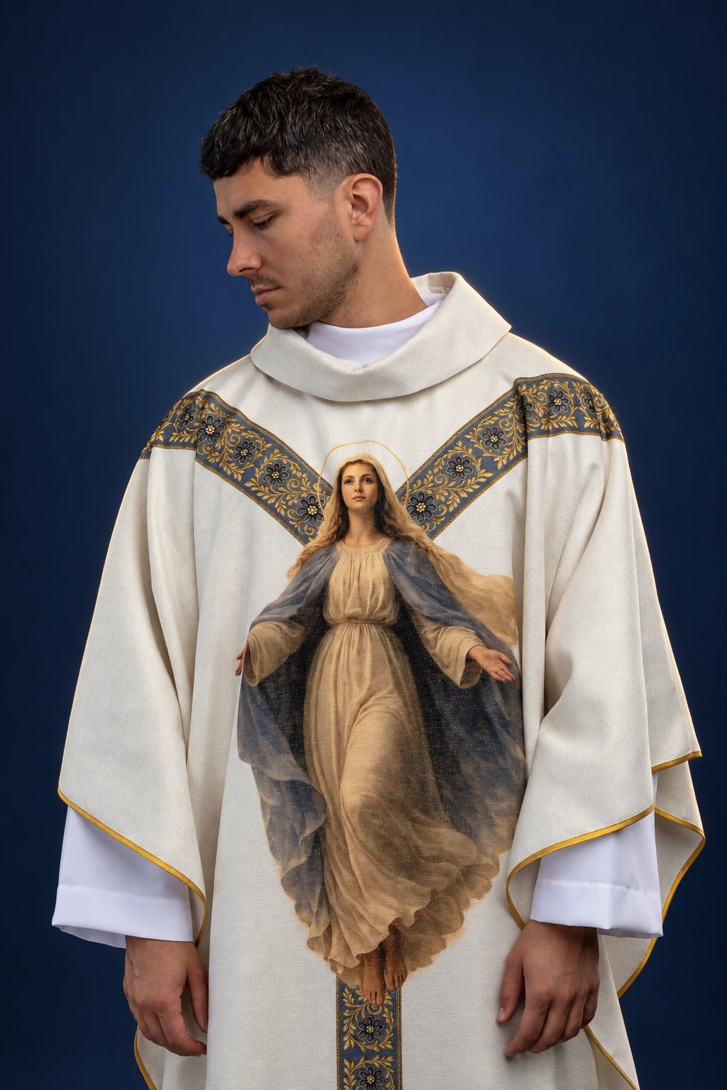 Front view of a white chasuble with dark patterned Y-band and printed Our Lady of the Assumption image