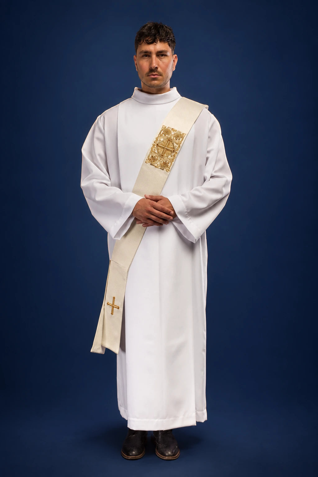 Front view of a white deacon stole with gold embroidered cross panel and cross near the hem, worn over a dalmatic-free alb