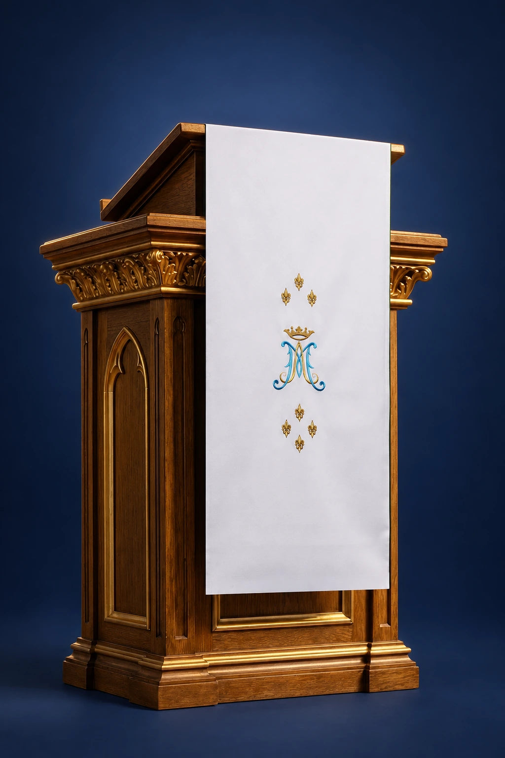 Front view of a white lectern cover with central Marian monogram and gold floral embroidery