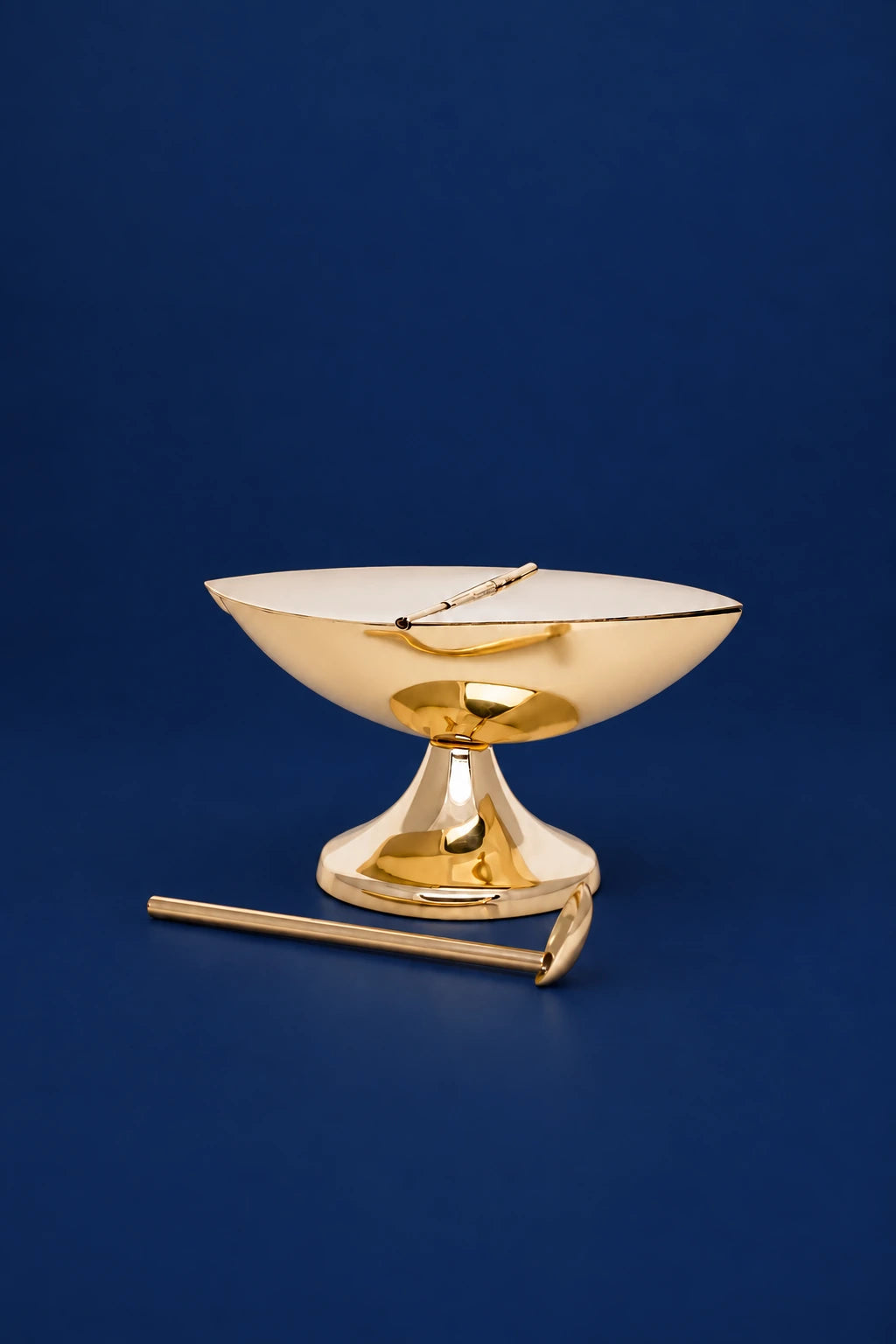 Gold brass incense boat with spoon, side view, on pedestal base