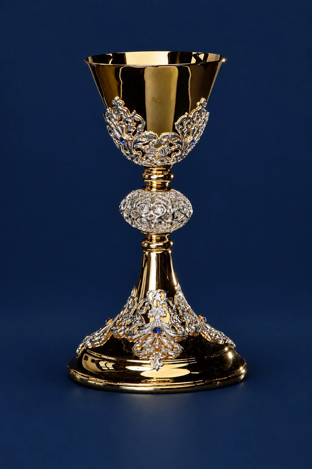 Gold-plated chalice with ornate silver and blue sapphire-like detailing, shown full front view