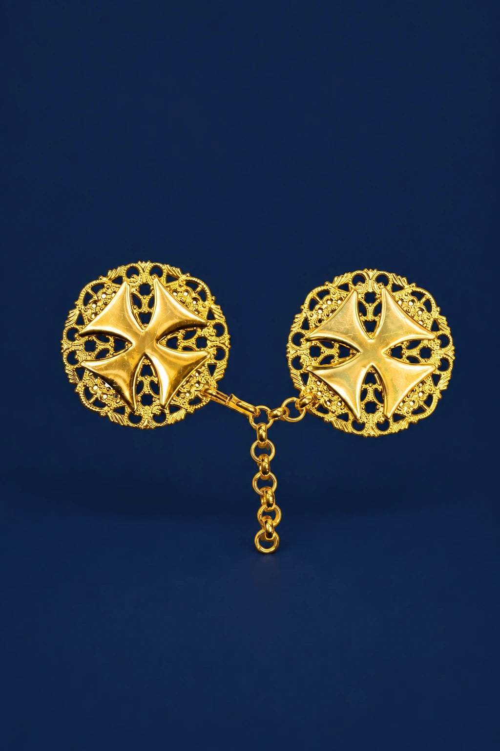 Gold veil clasp with two ornate circular crosses linked by a short chain, front view