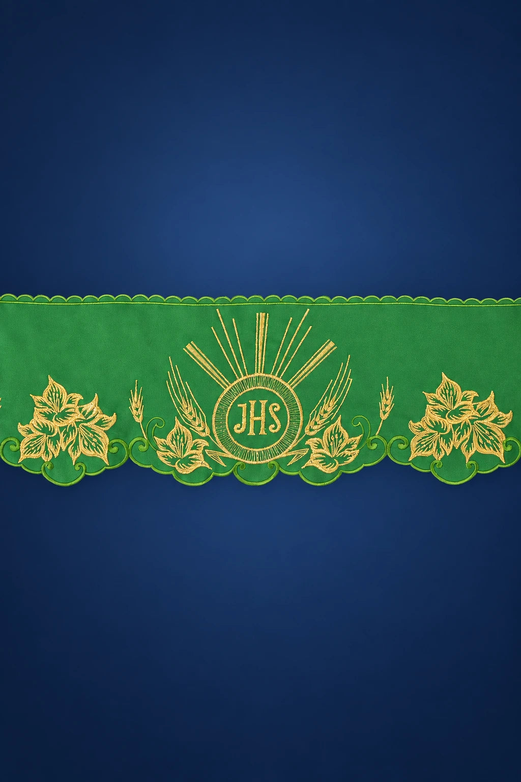 Green altar lace trim with scalloped edge and gold IHS embroidery, shown laid flat