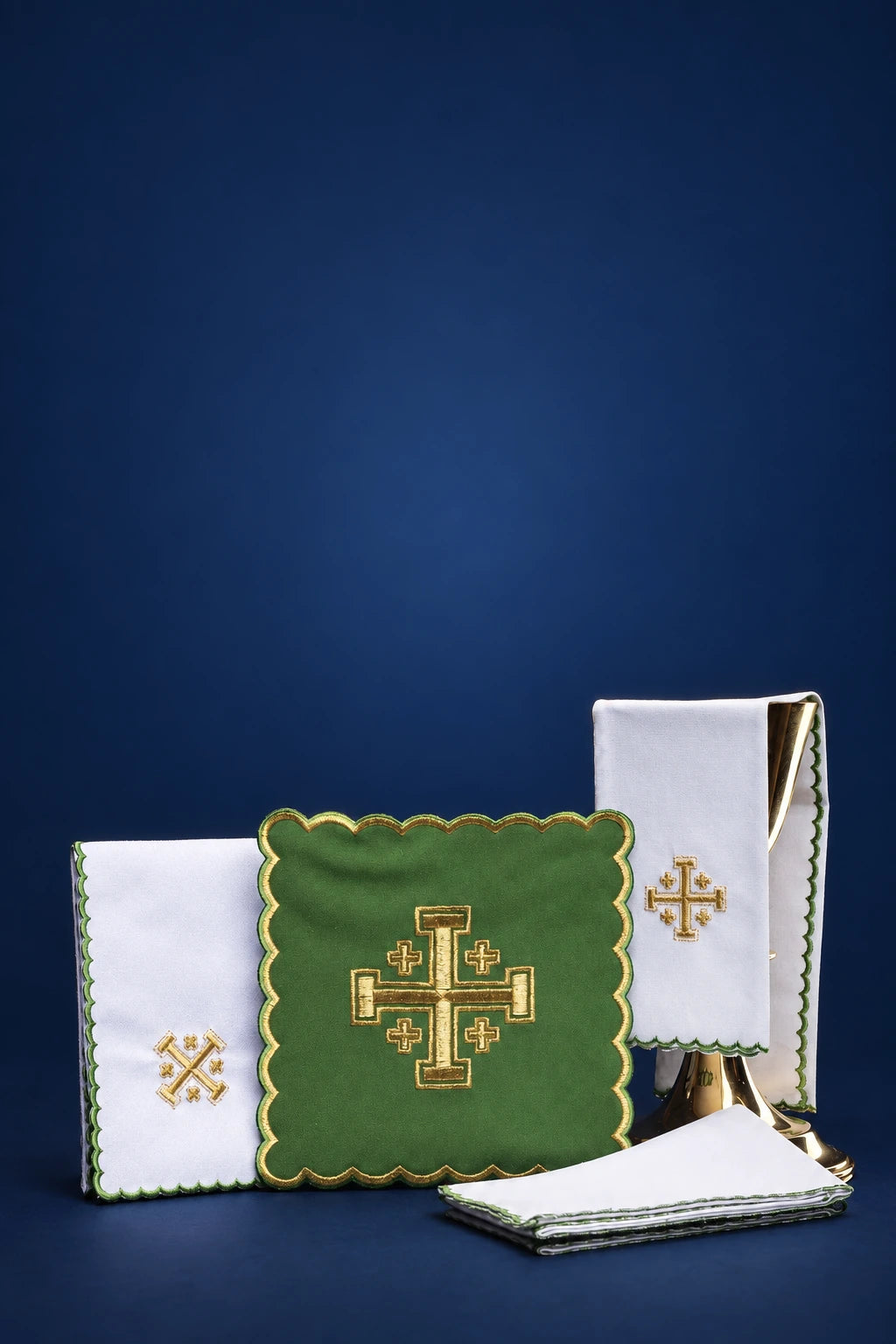 Green altar linen set with embroidered Jerusalem crosses, shown folded with scalloped trim and gold accents