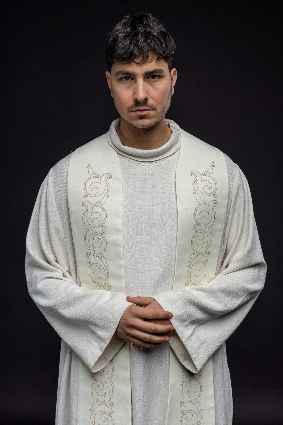 Roman stole in ecru, upper front view with gold scroll embroidery
