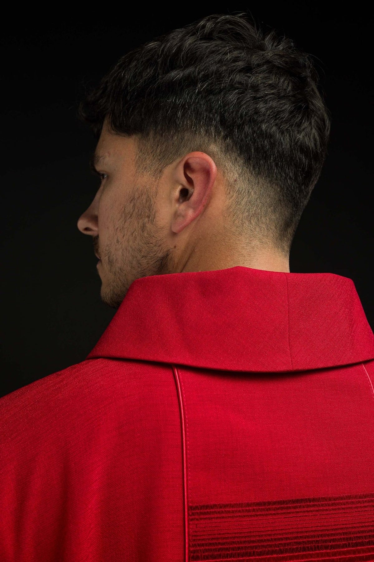 Red chasuble back close-up with stand-up collar and embroidered trim