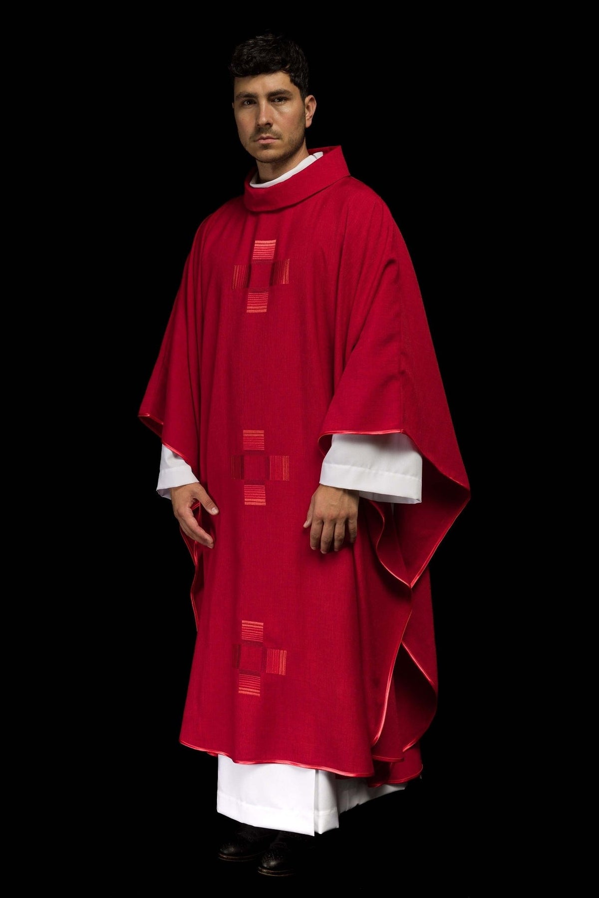 Red chasuble three-quarter view with front embroidered crosses