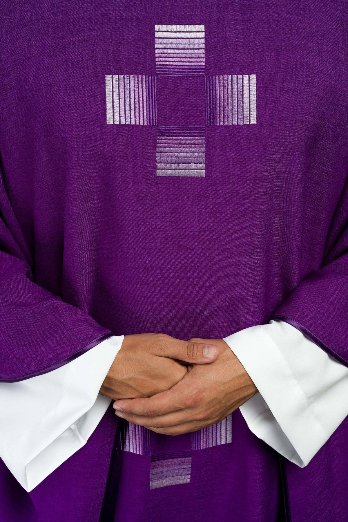 Purple chasuble close-up of silver embroidered cross on the front