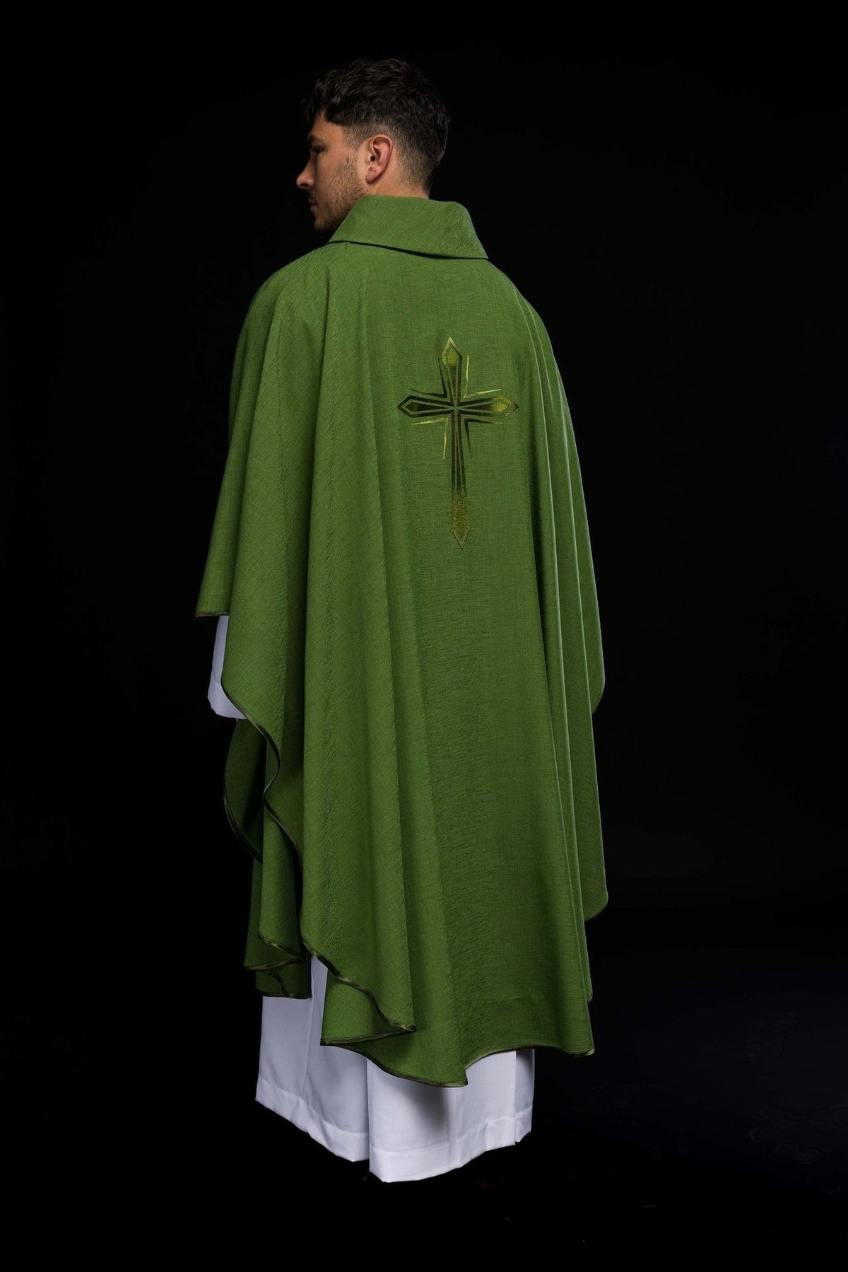 Green chasuble shown from the rear three-quarter view with cross and dark trim