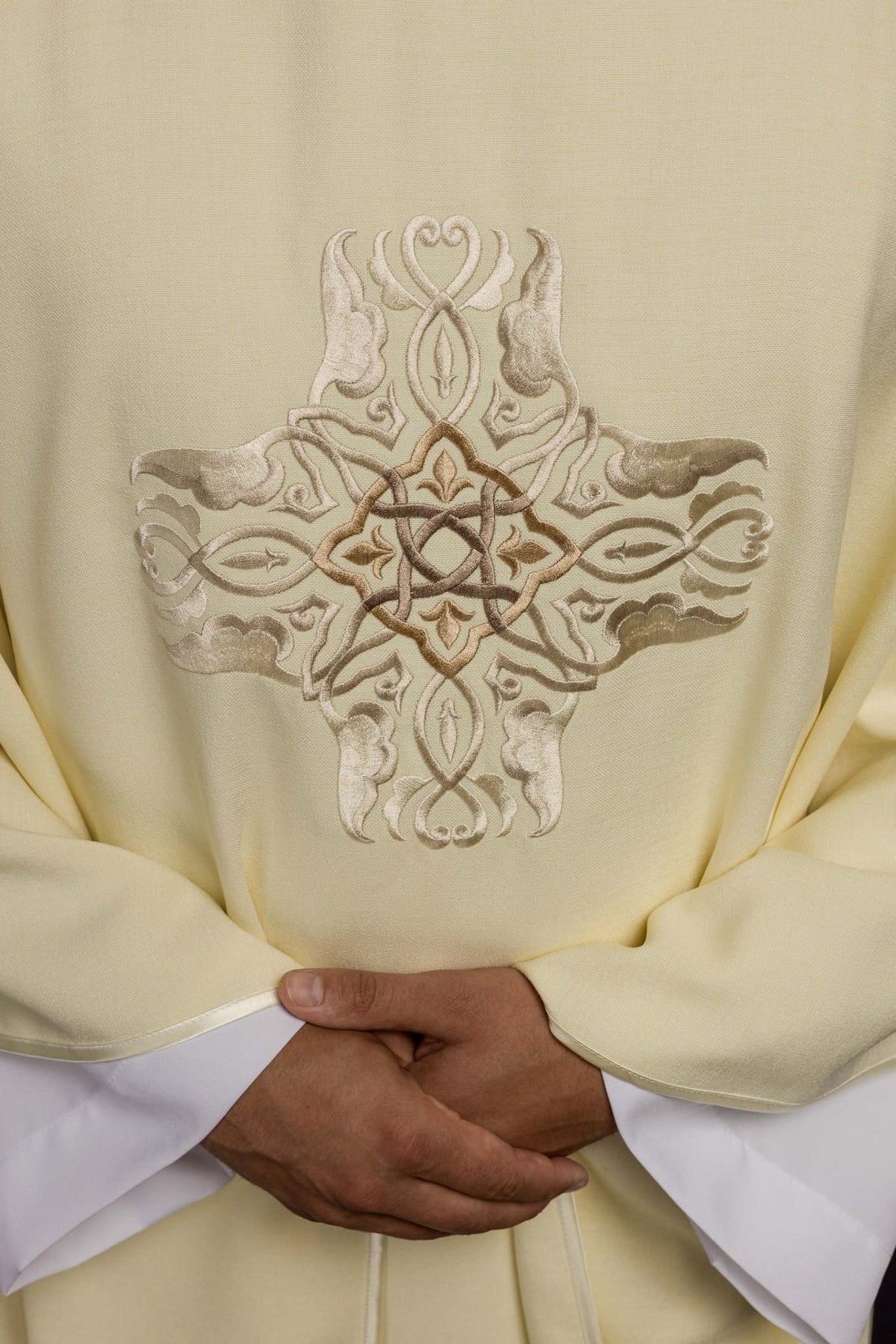 Ecru chasuble close-up of embroidered cross design