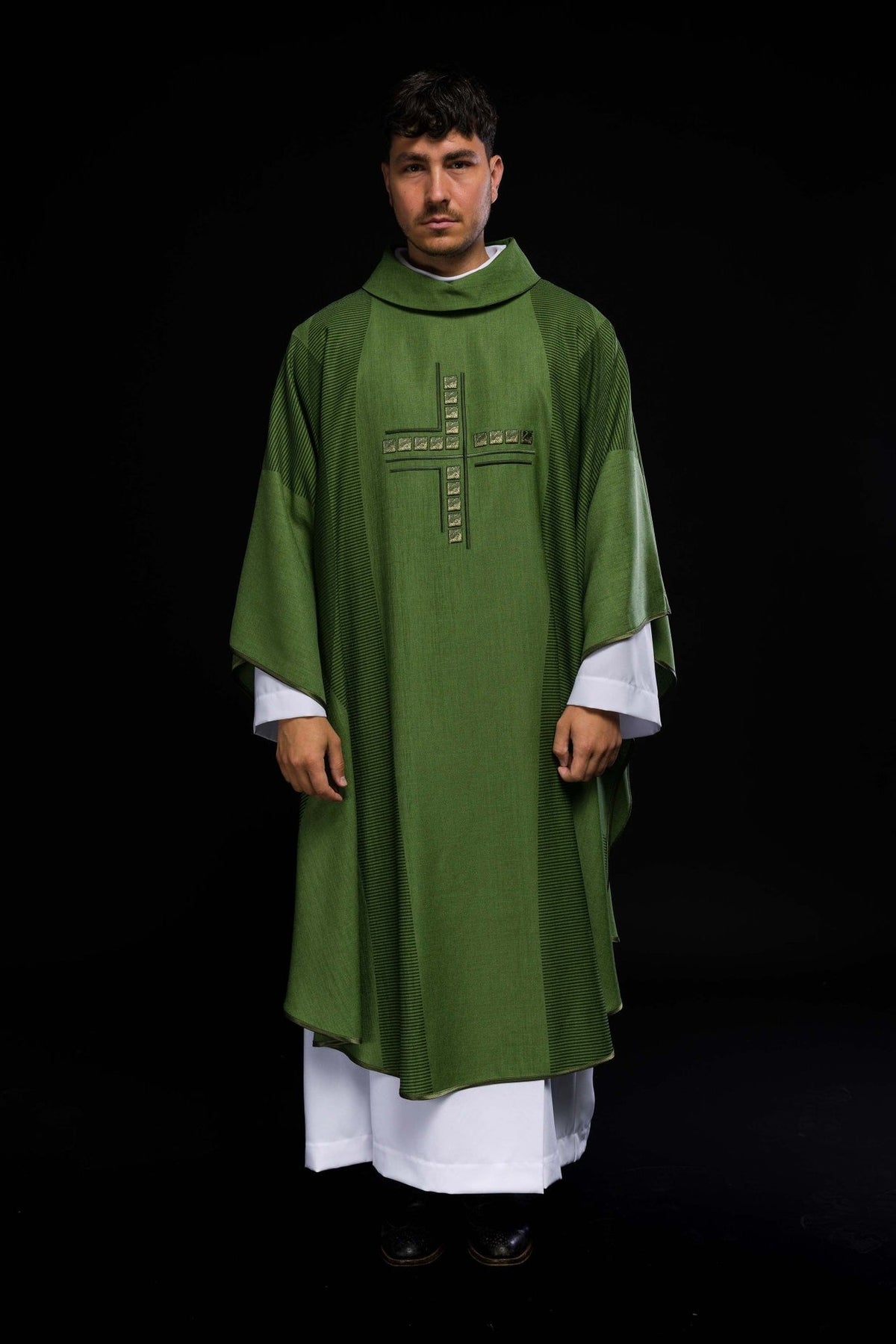 Green chasuble front view with embroidered cross and dark striped side panels