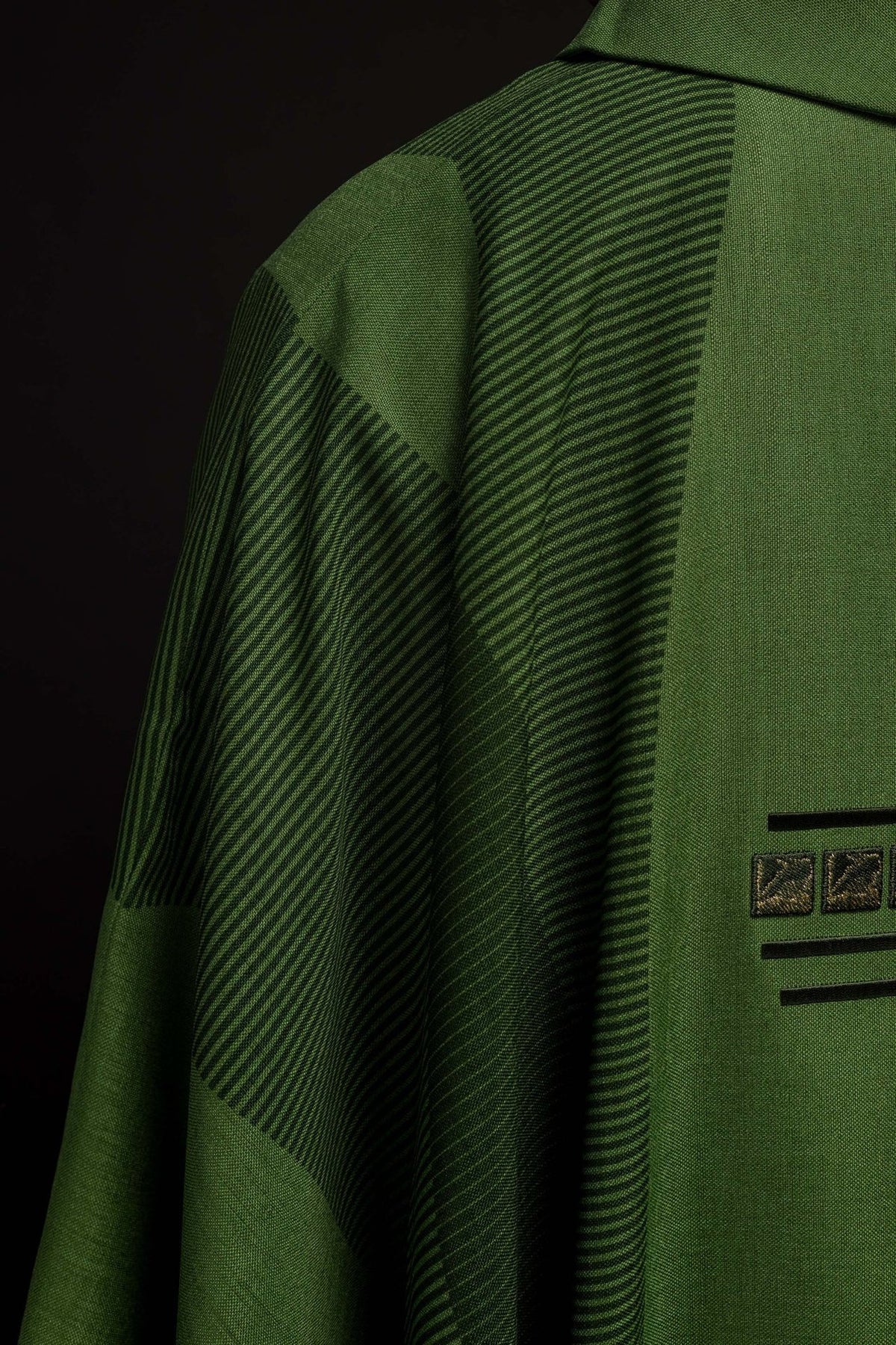 Green chasuble back view with embroidered cross and stand-up collar