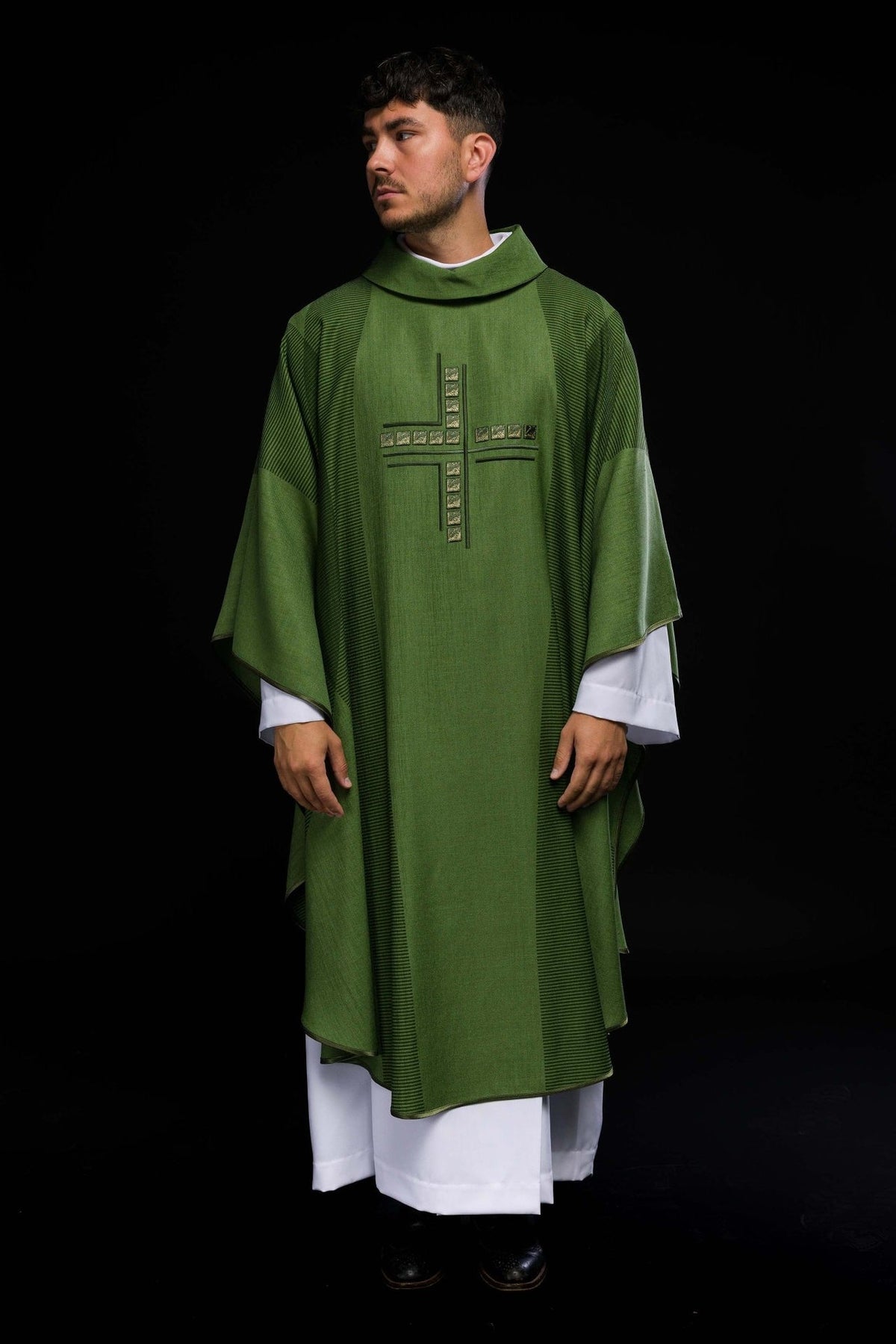 Green chasuble back view with embroidered cross and striped side panels