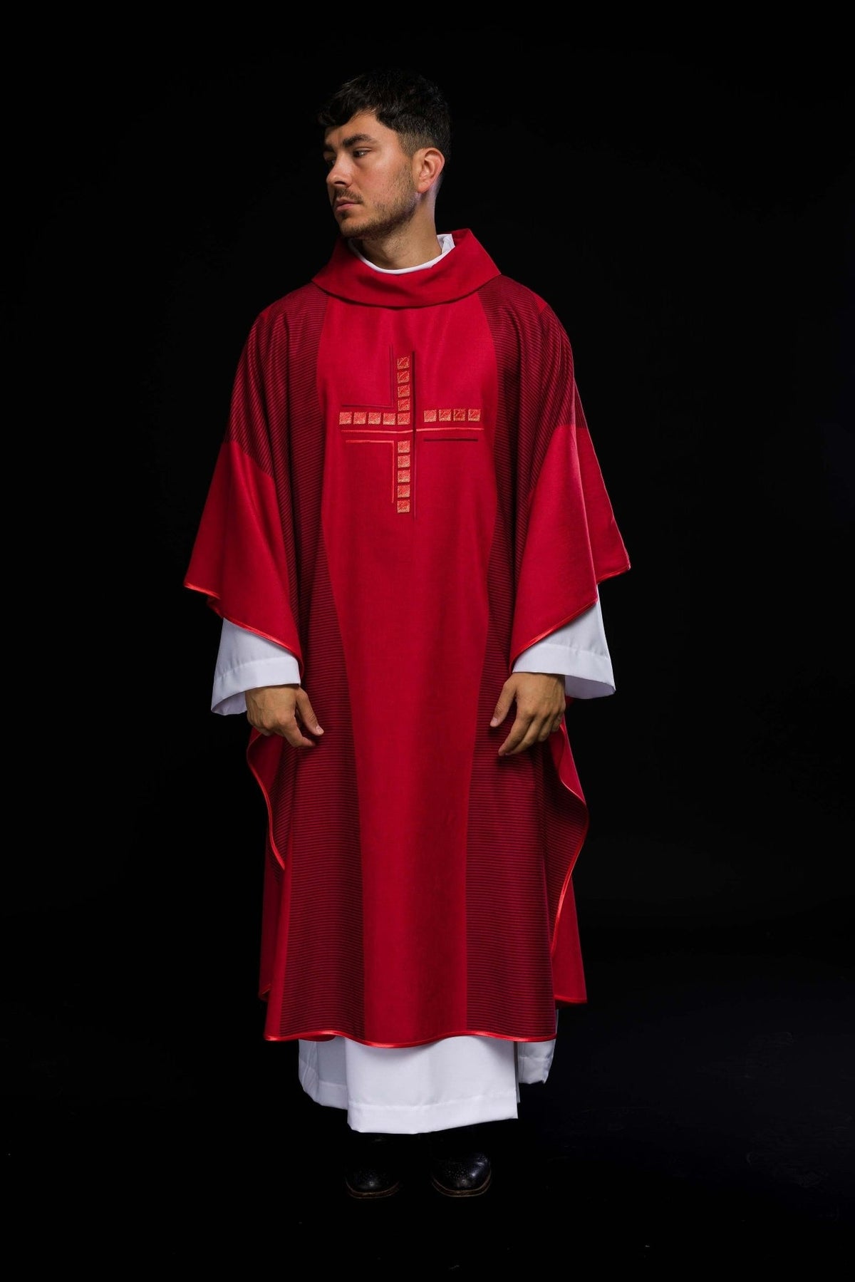 Red chasuble front view with embroidered cross and striped trim