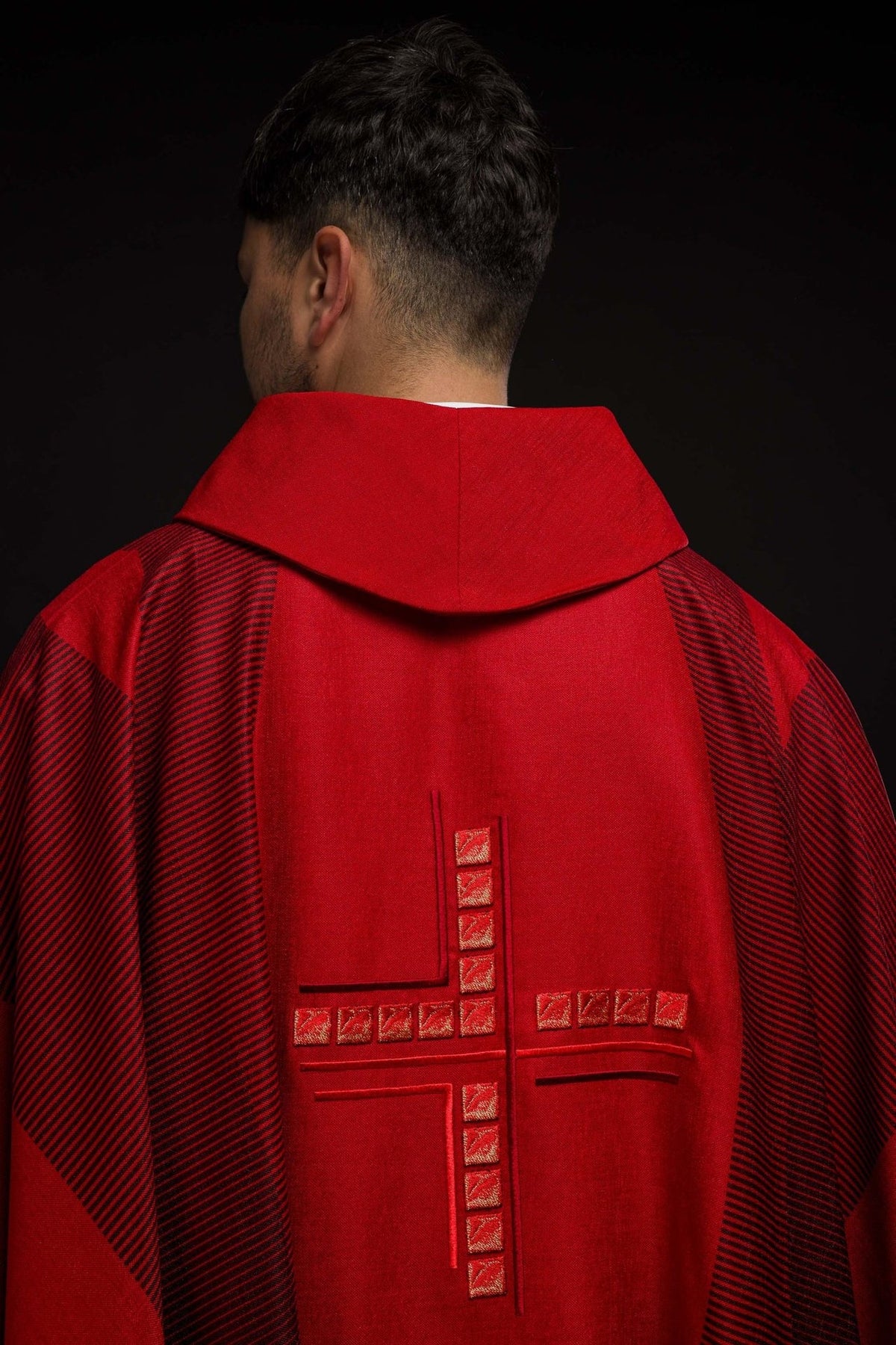 Red chasuble back close-up with stand-up collar and embroidered cross
