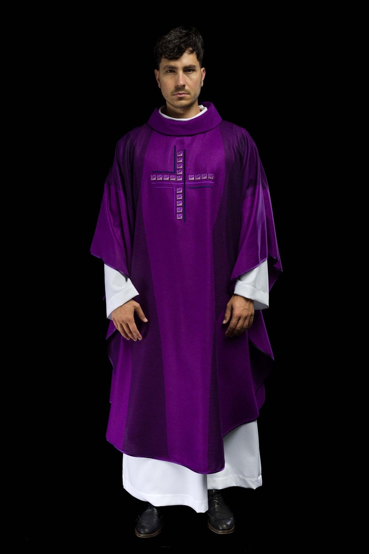 Purple chasuble front view with embroidered cross and dark striped trim
