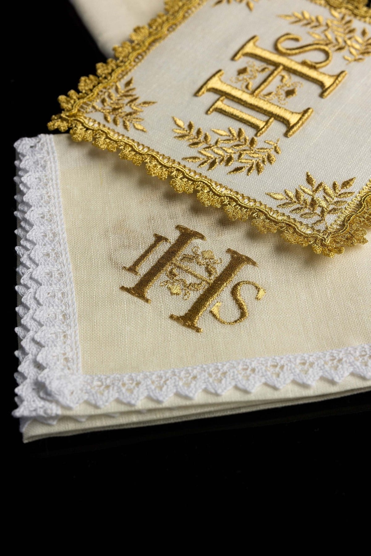 Altar linen set detail showing gold IHS embroidery and white lace edging