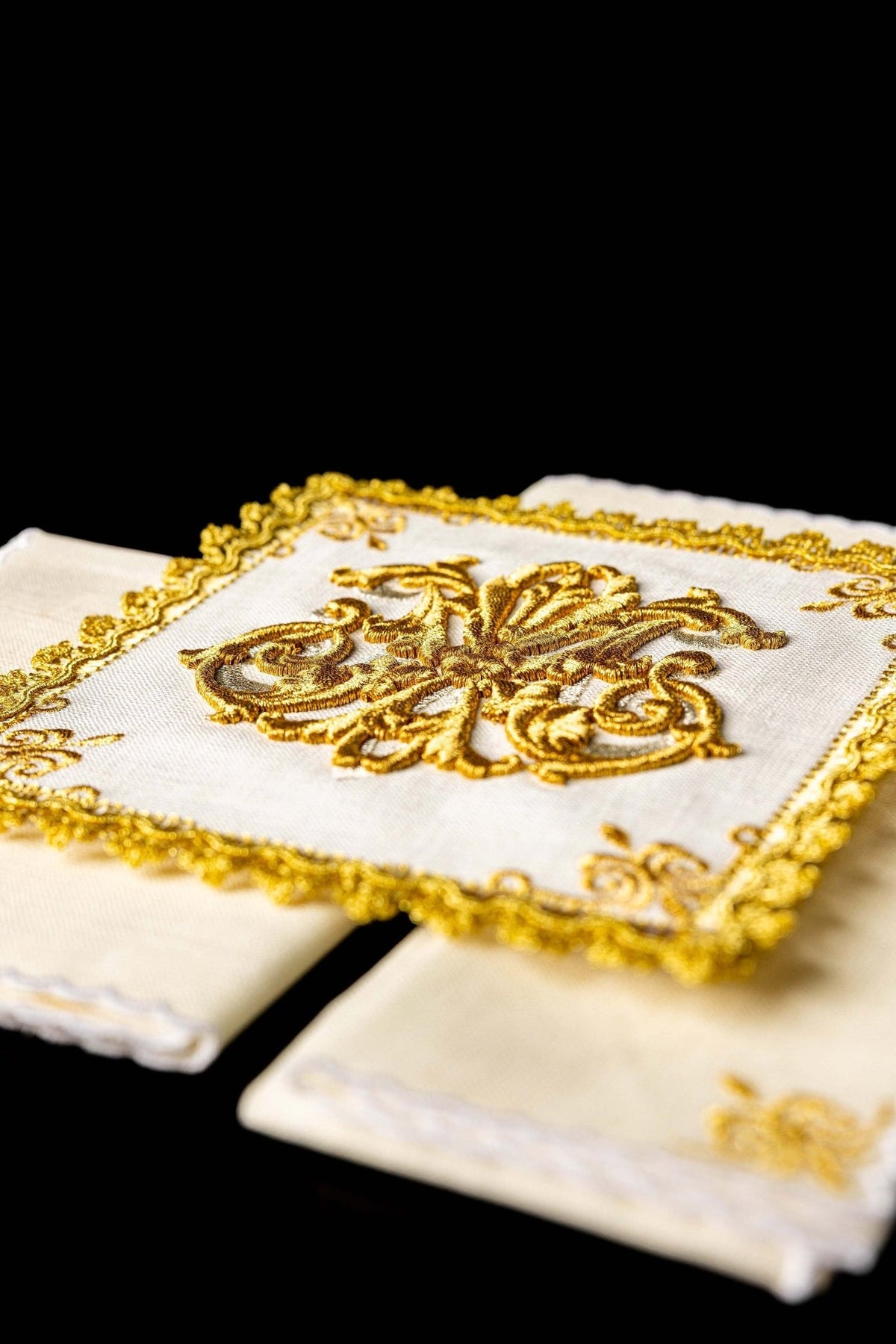 Altar linen set angled view showing raised gold embroidery and decorative border