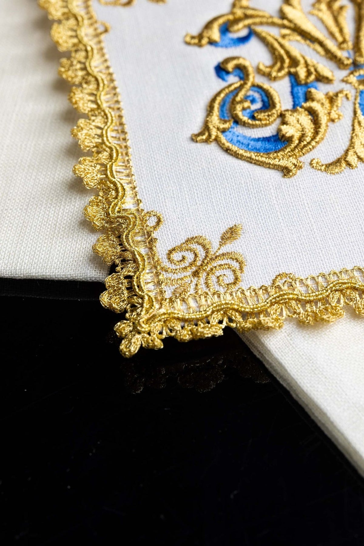 Altar linen set close-up showing raised gold and blue Marian symbol embroidery