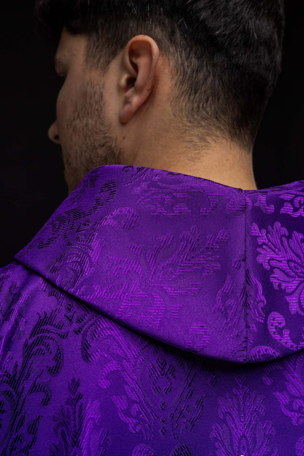 Purple chasuble stand-up collar and patterned fabric close-up