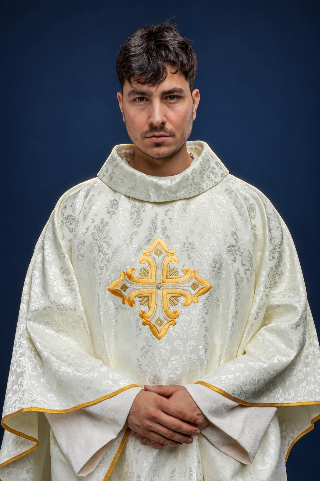 Ecru Chasuble with a Cross in Patterned Fabric, front view with gold embroidered cross and gold trim