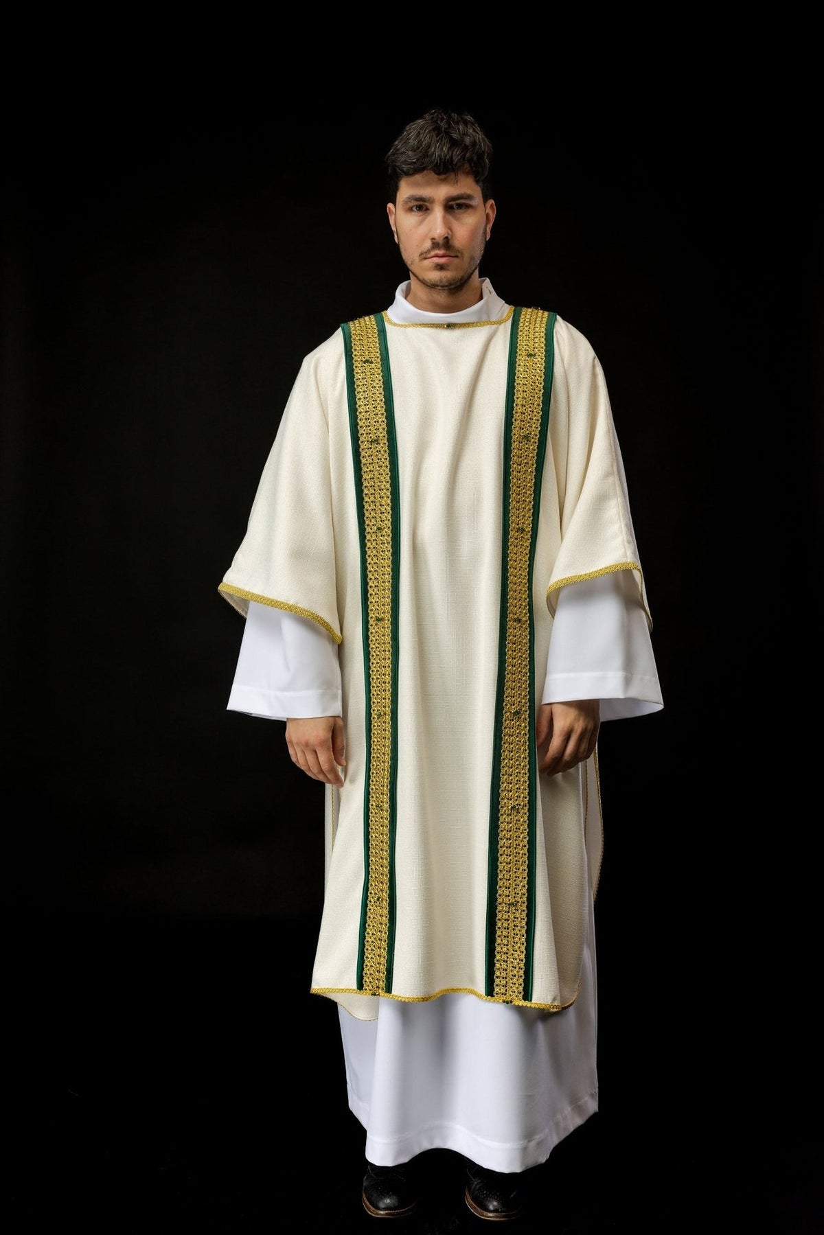 Handcrafted dalmatic worn full front view in ivory with green and gold orphrey