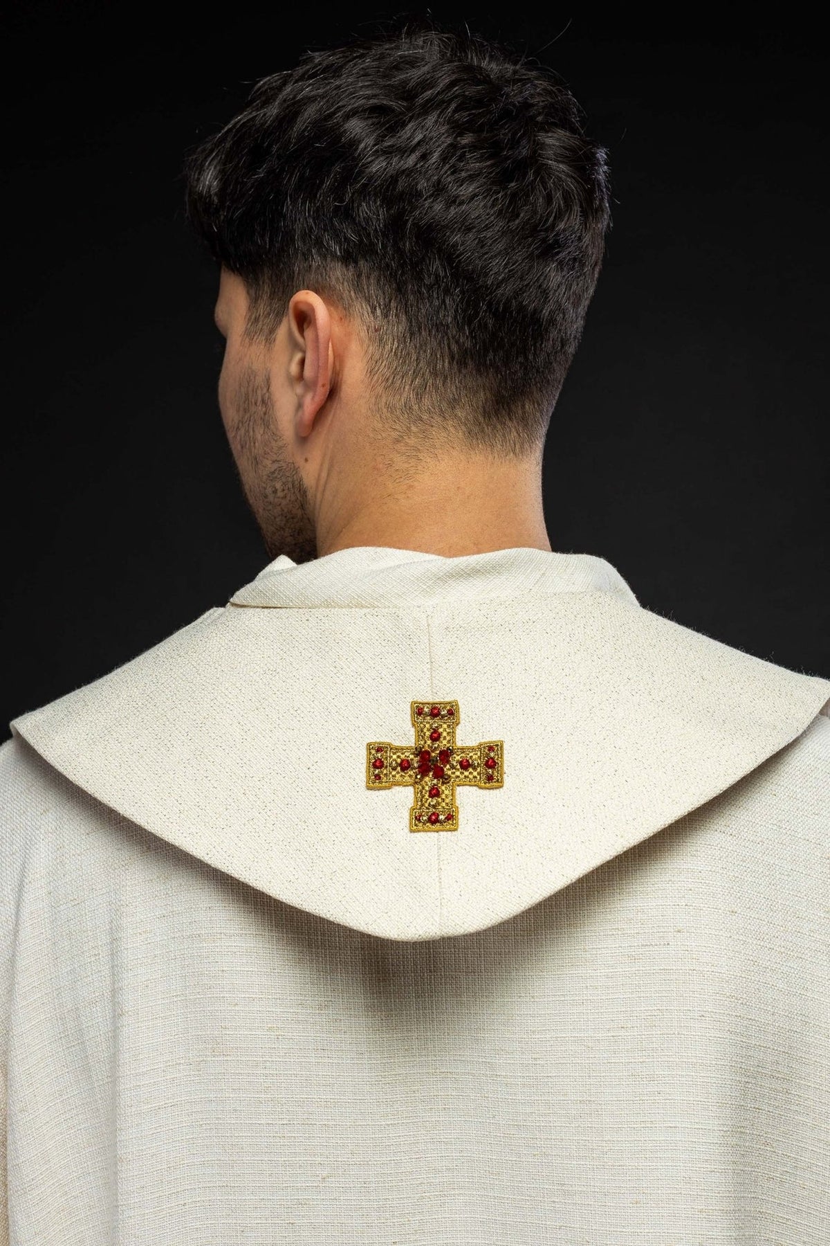 Stole back view showing a central gold cross with red stones