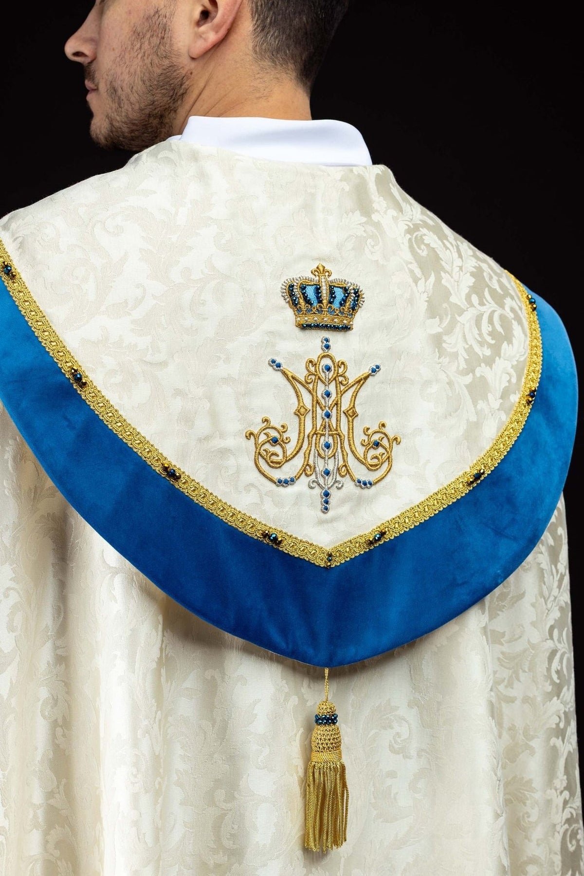 Marian cope back view with blue velvet yoke, Marian symbol embroidery and gold tassel