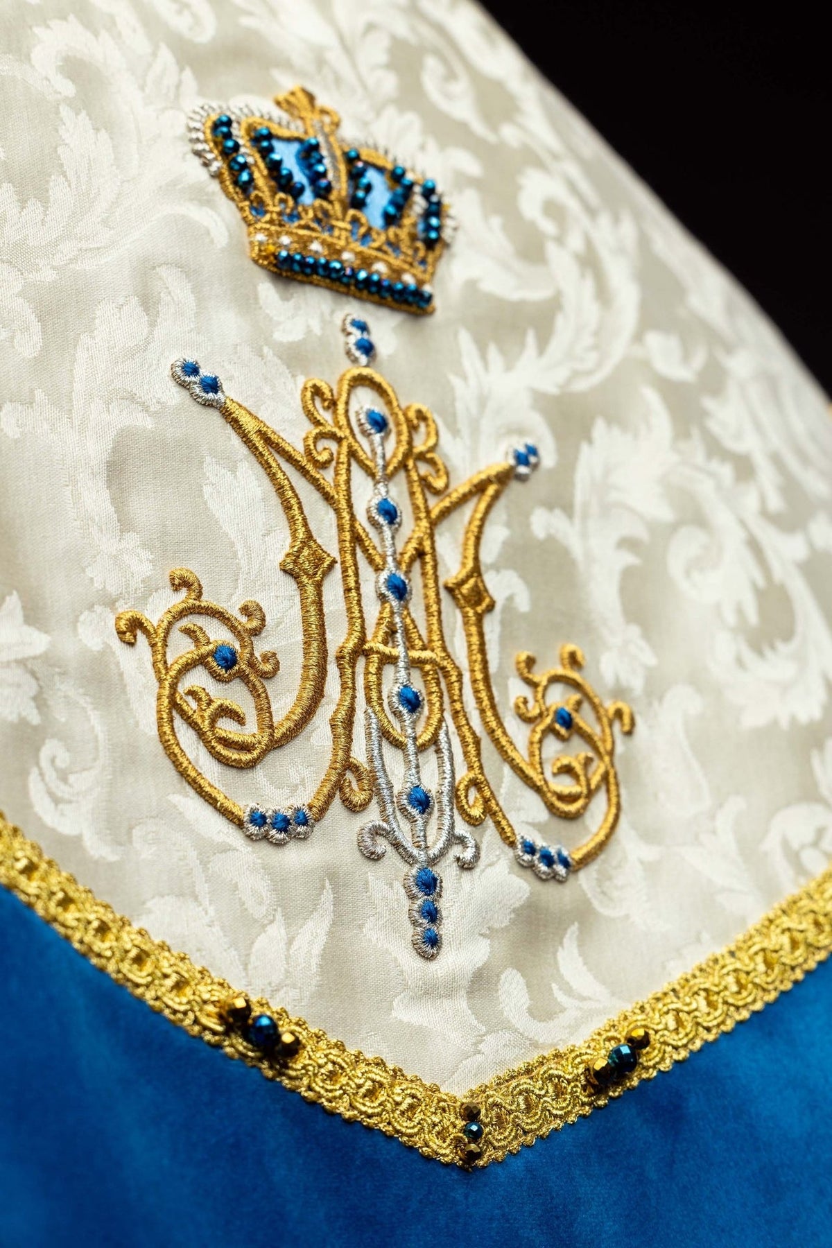 Marian cope back detail with embroidered crown and Marian symbol