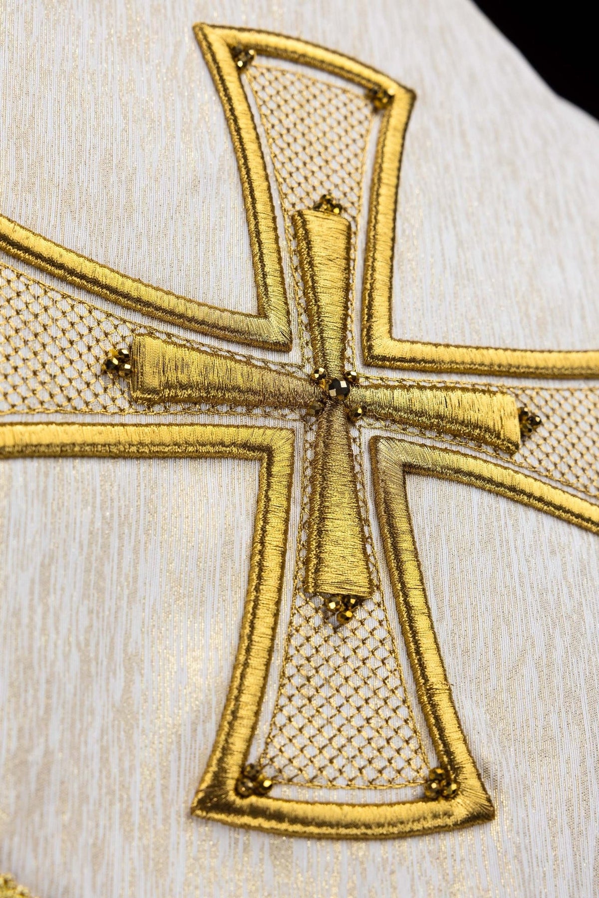 Handcrafted cope back with gold cross embroidery and natural stones