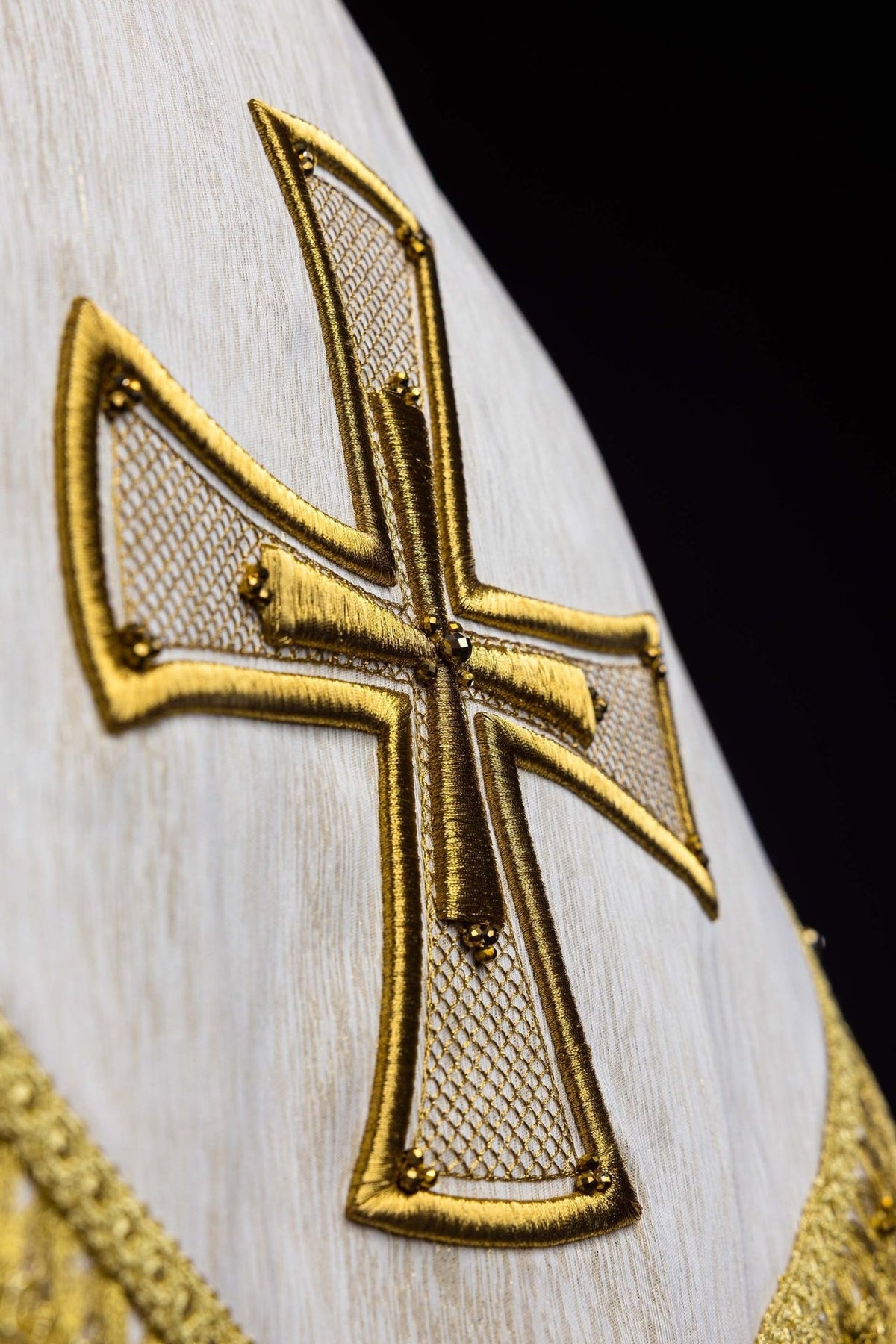 Handcrafted cope gold cross embroidery with lattice detail and natural stones
