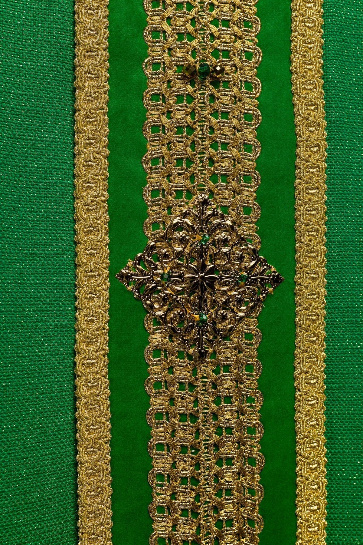Green chasuble front orphrey close-up with a decorative gold cross
