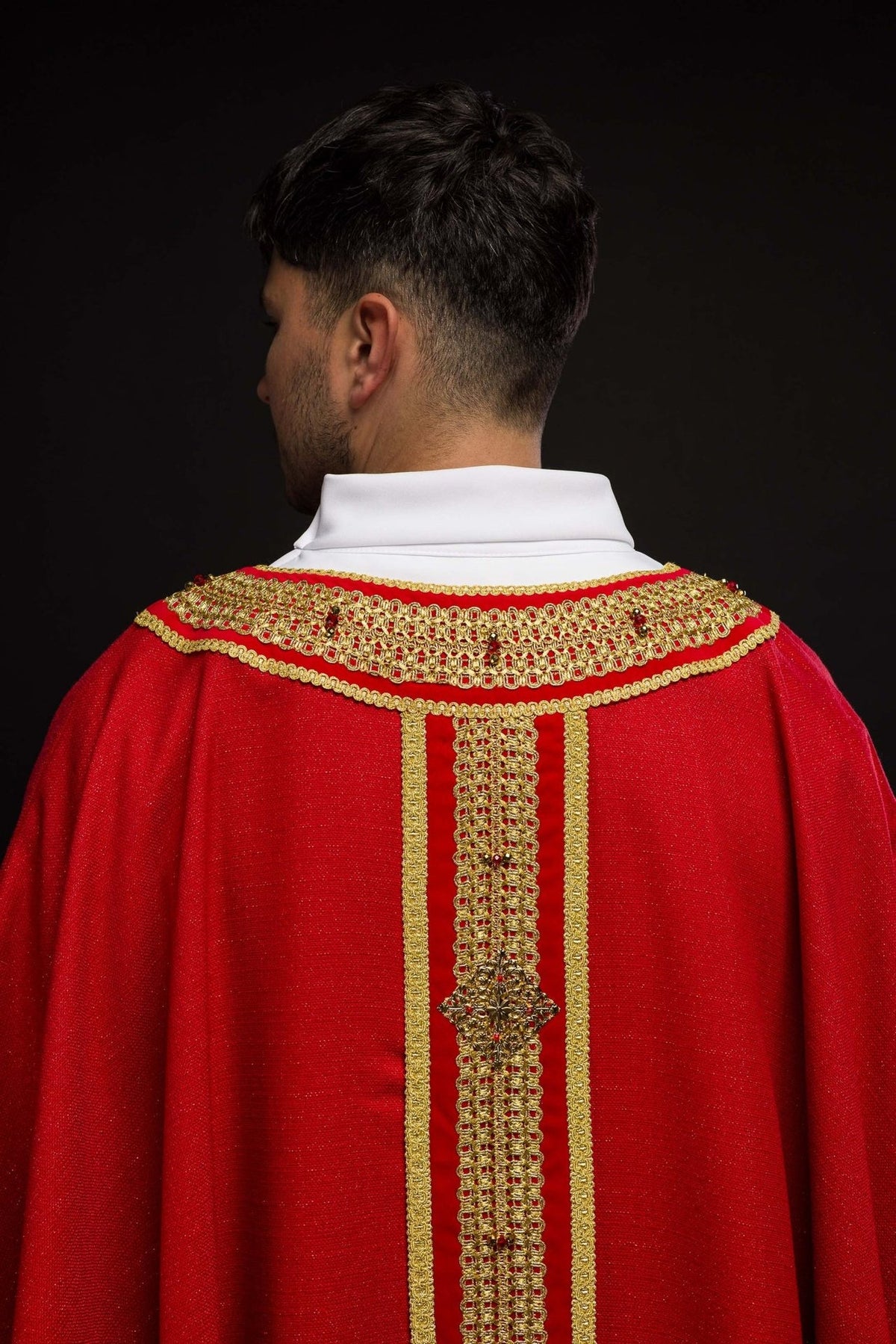 Handcrafted chasuble in red, back view with gold embroidery, orphrey and natural stones