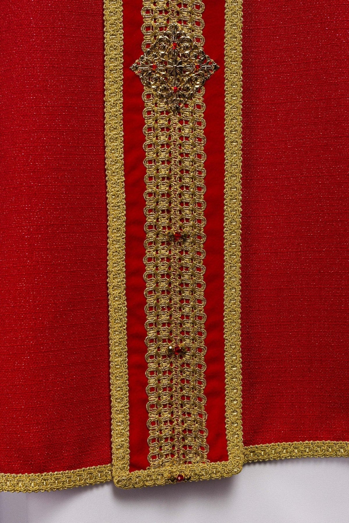 Red chasuble collar and upper orphrey close-up with gold embroidery