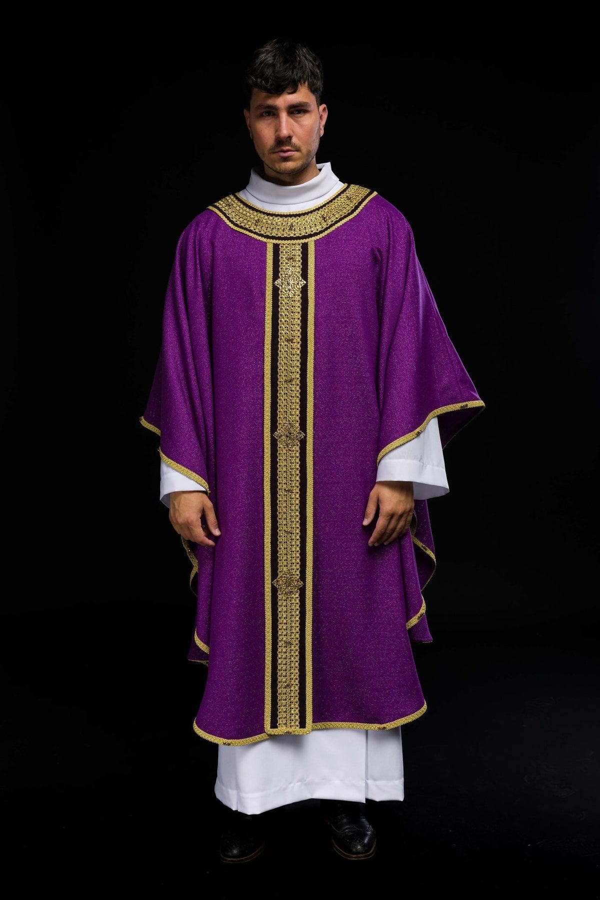 Purple chasuble worn from the front, with gold orphrey and natural stones