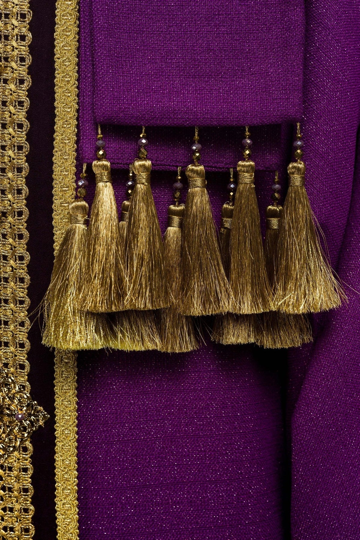 Purple chasuble gold embroidery detail with cross motif and tassel