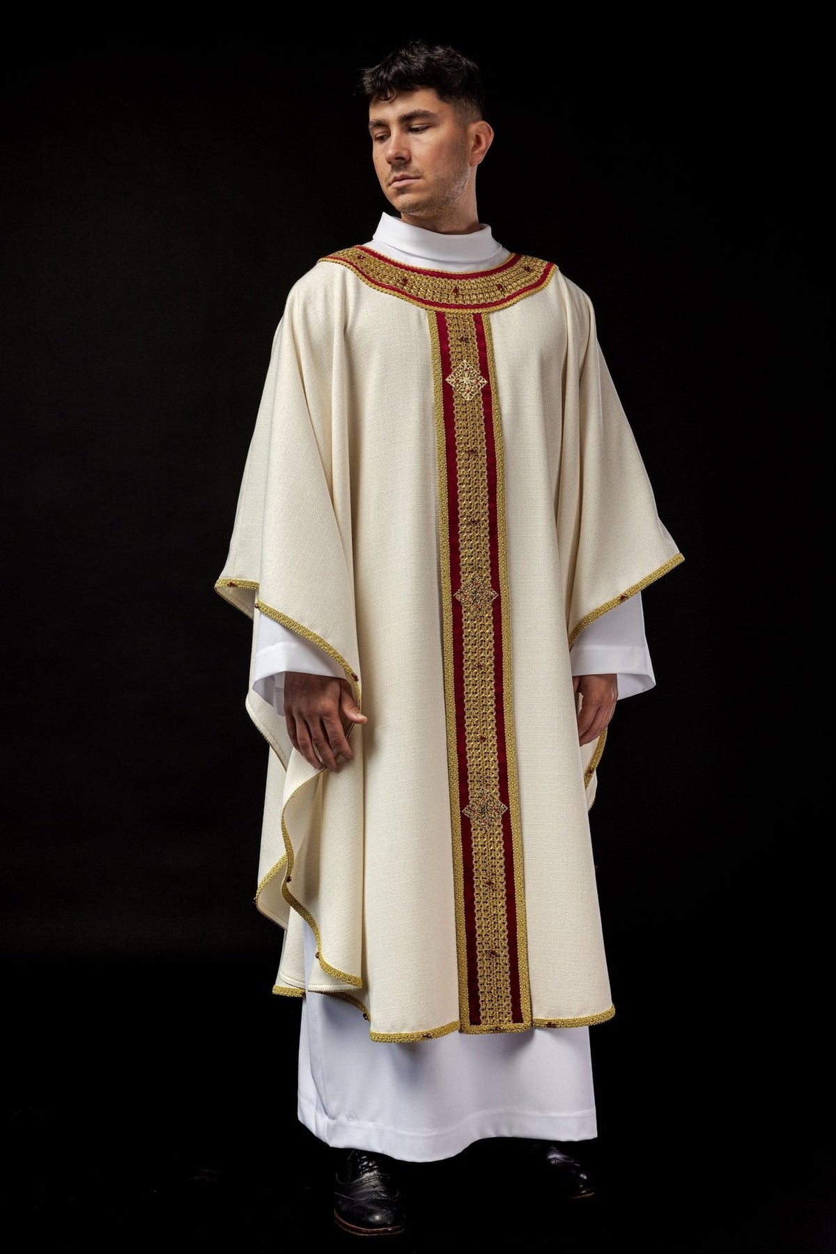 Full front view of the ivory chasuble with red and gold orphrey